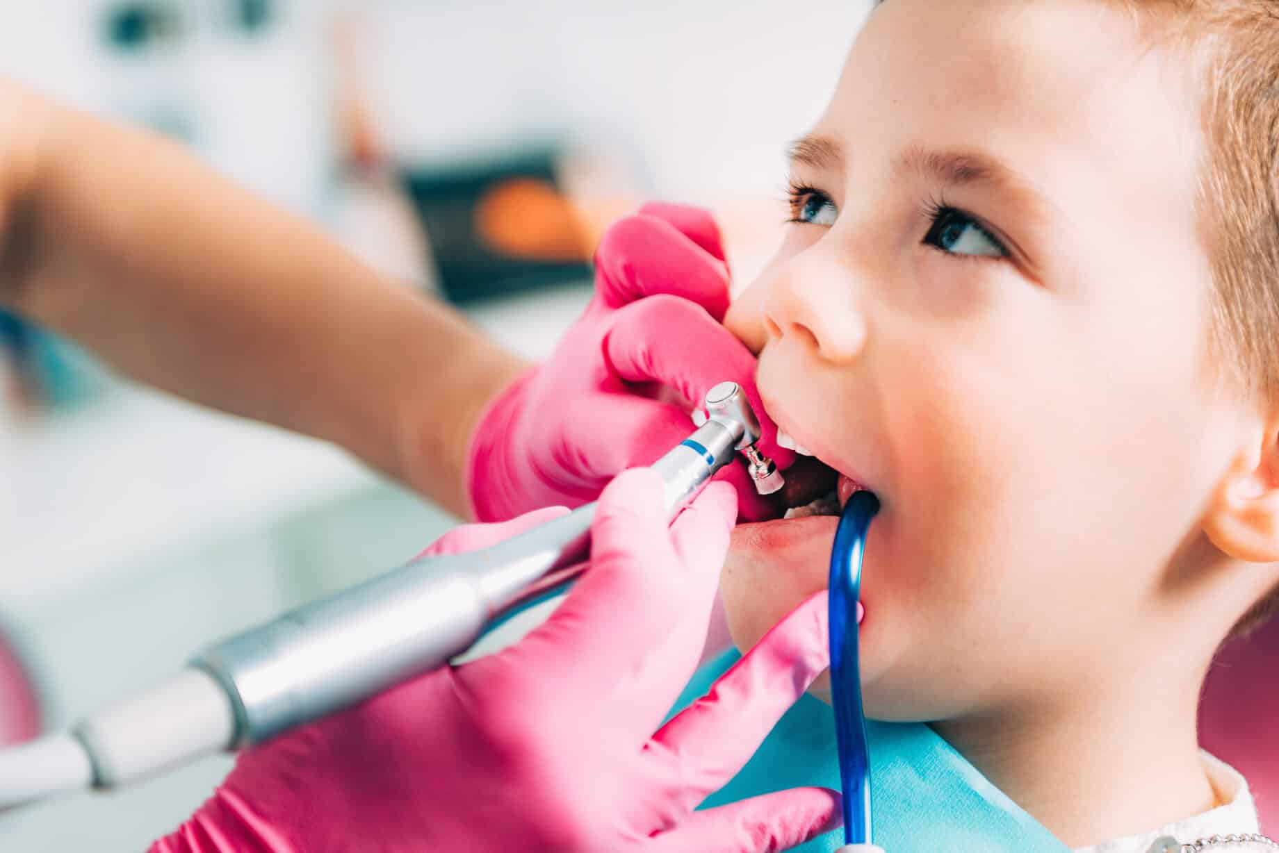 child having teeth cleaned