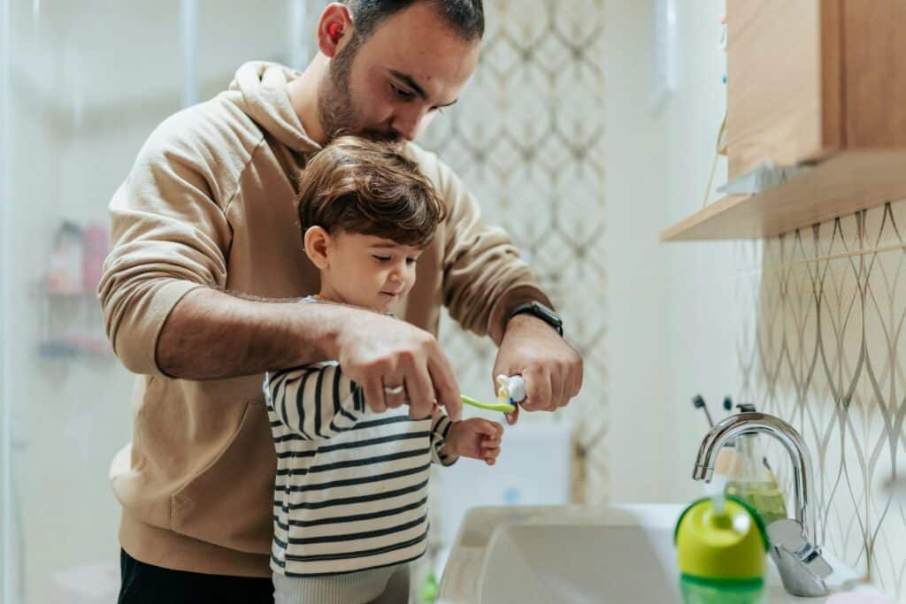 child brushing teeth