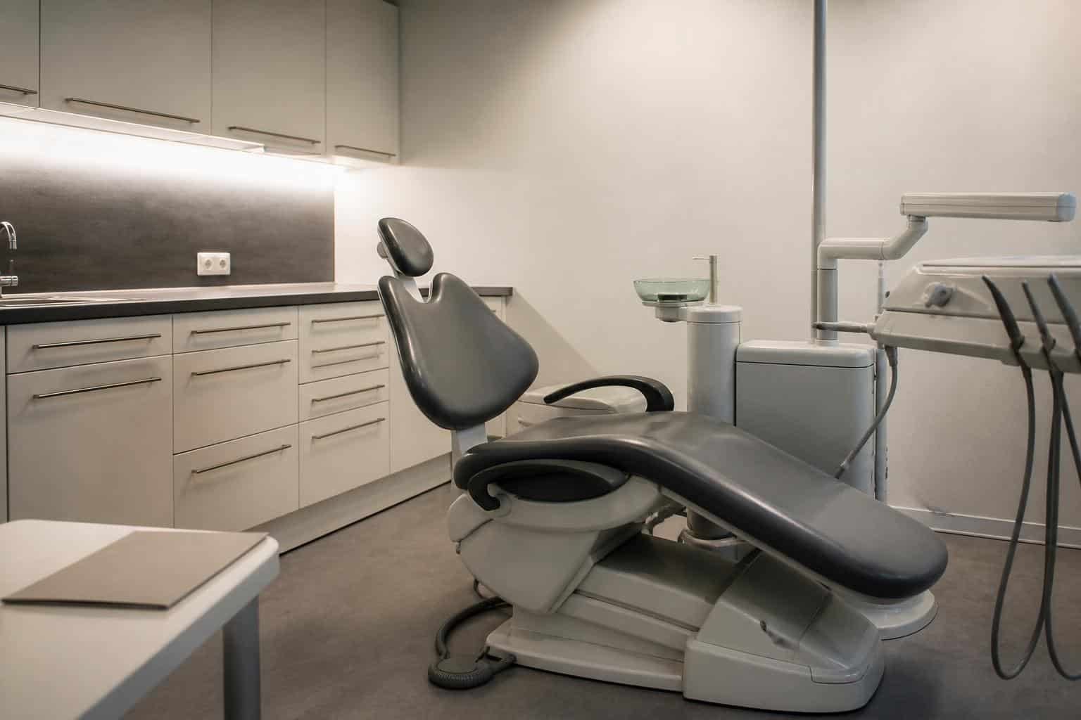 Empty dental treatment room prepared for a consultation