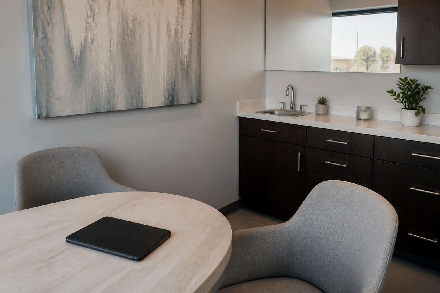 Private dental consultation room with a closed tablet on the table