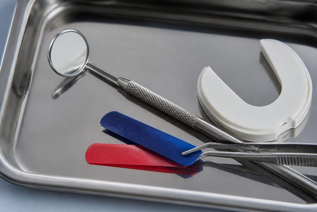 Dental bite-assessment tools arranged on a clinical tray