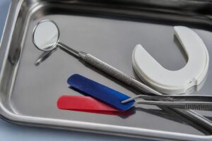 Dental bite-assessment tools arranged on a clinical tray