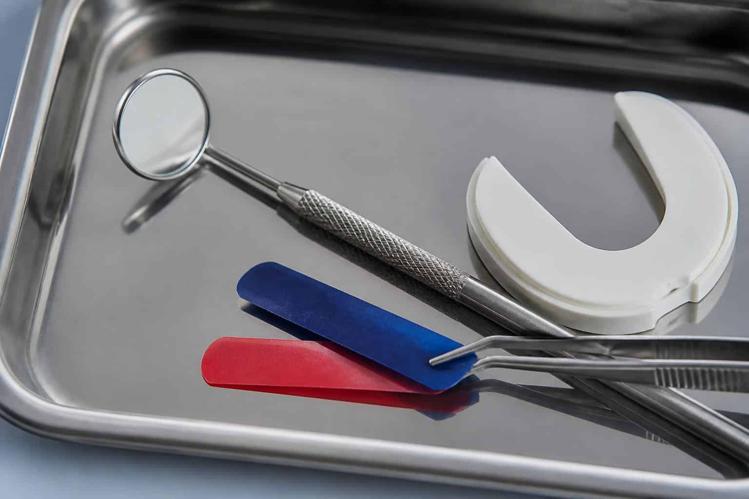 Dental bite-assessment tools arranged on a clinical tray