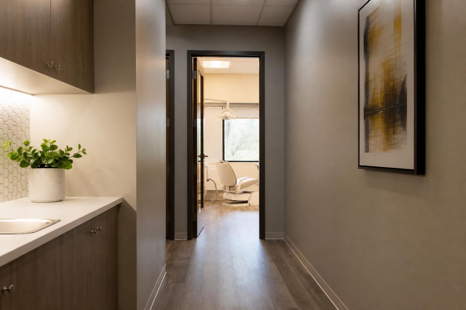 Dental hygiene treatment room hallway leading toward a deep cleaning appointment room